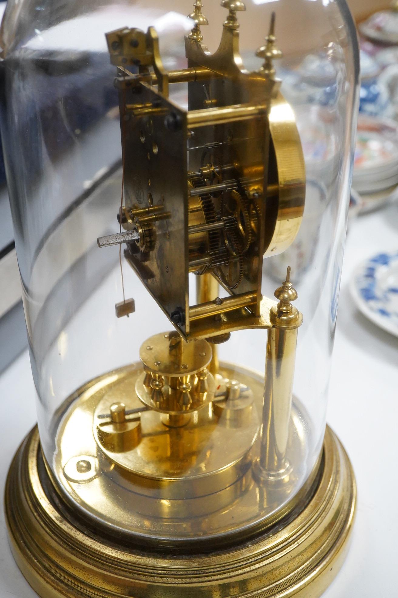 A late 19th century 400 day brass Anniversary clock, under glass dome, 29cm high